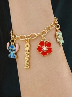 Gold Charm Bracelet with Blue Stitch and Red Flower Charms